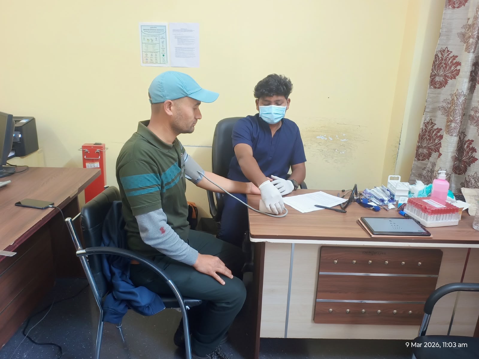 Blood pressure check at a workforce health camp